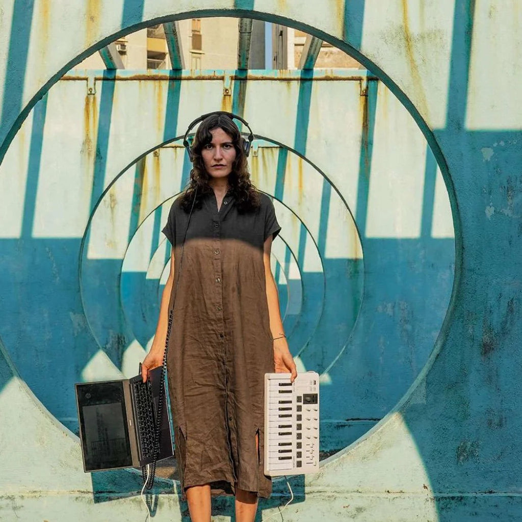 Arturia MiniLab 3 MIDI keyboard with compact design, featuring colorful knobs and keys, suitable for music production and studio use.