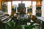 Moog Matriarch synthesizer with patch cables and control knobs, showing its vintage-inspired design and multiple audio and modulation inputs.
