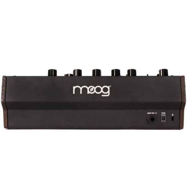 Moog Mother-32 semi-modular synthesizer with patch cables and control knobs, black and orange design, front view.
