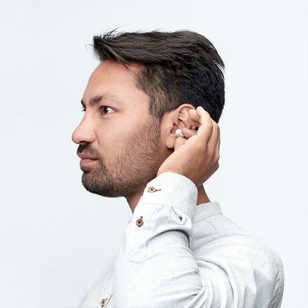 Alpine Music Safe Classic Earplugs for hearing protection, shown inserted, designed for musicians and noise-sensitive environments.