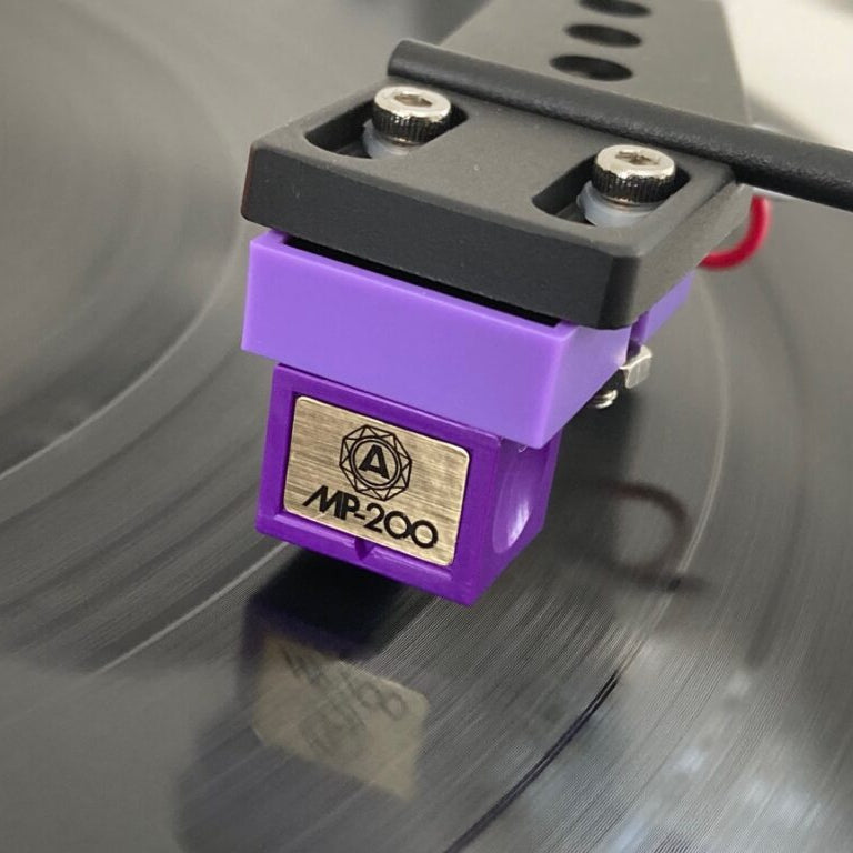 Nagaoka MP-200 turntable cartridge with stylus mounted on headshell for high-quality audio playback.