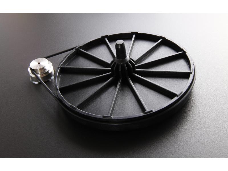 Rega Planar 1 Plus turntable with sleek black platter, tonearm, and modern design, showcasing high-quality audio equipment.