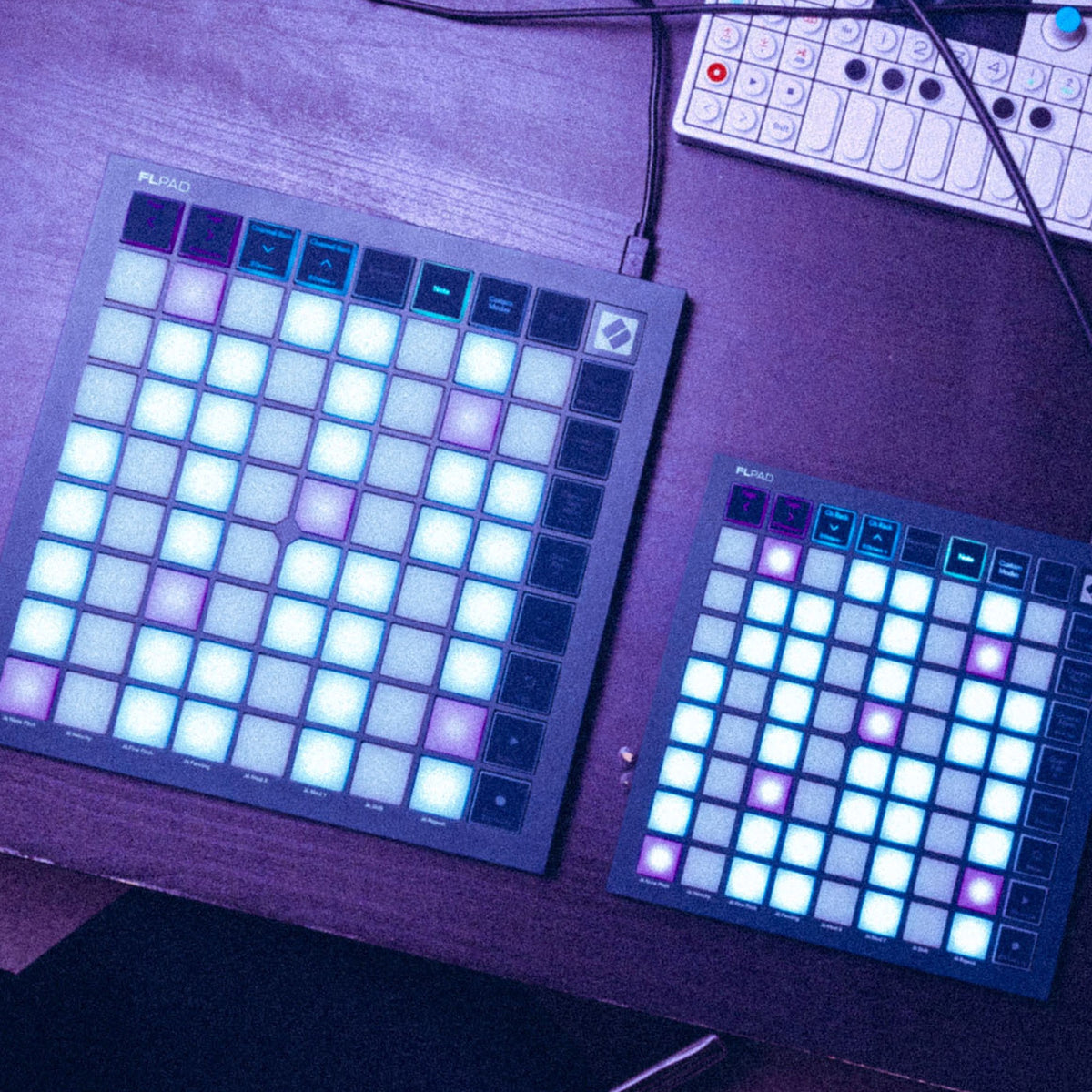 Novation FLpad Mini, next to the full-size FLpad on a studio desk