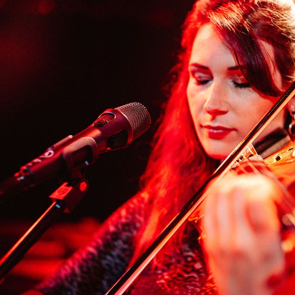 Austrian Audio OD303 dynamic microphone set up for live performance, with a sleek design and professional build.