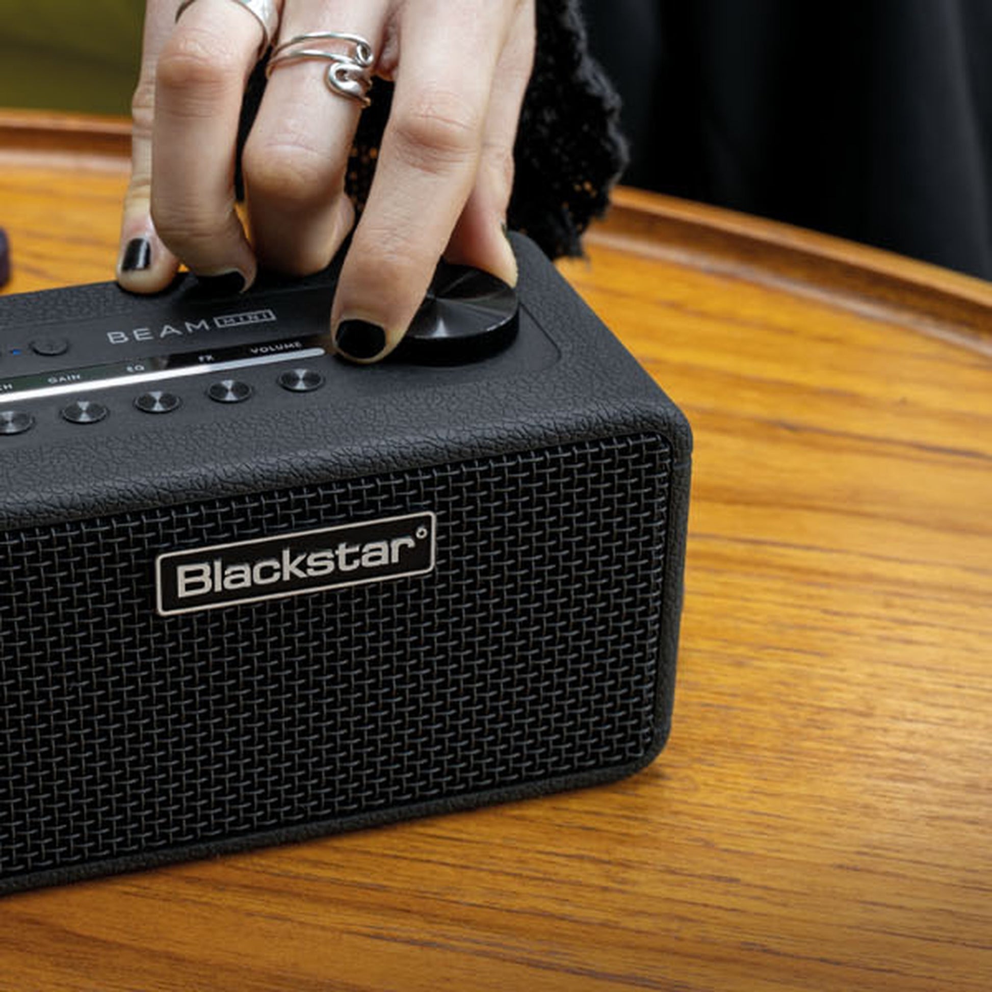 Blackstar Beam Mini on a table being adjusted by hand