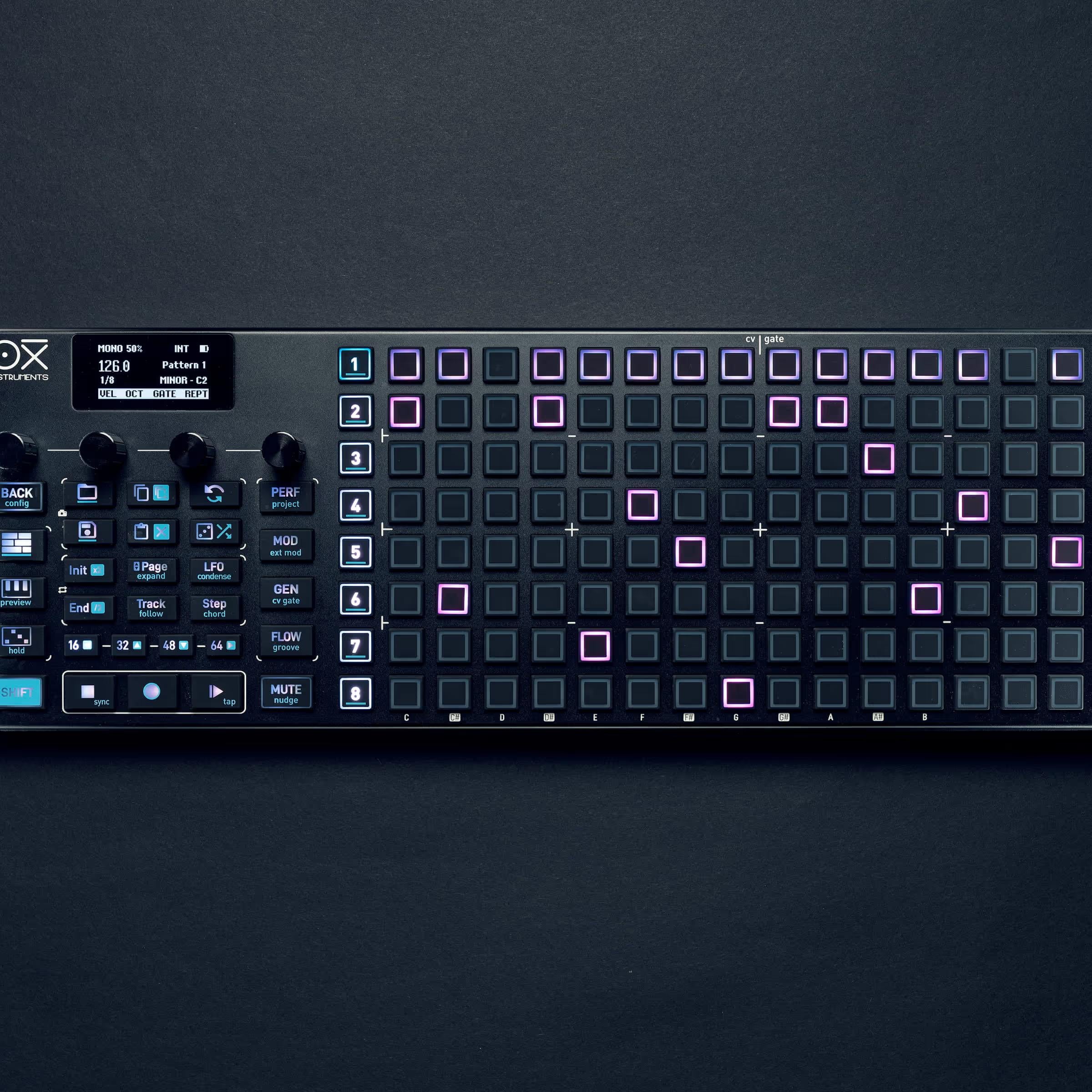 OXI Instruments One MKII Nostalgia sequencer with colorful buttons and vintage-inspired design, displayed on a desk.