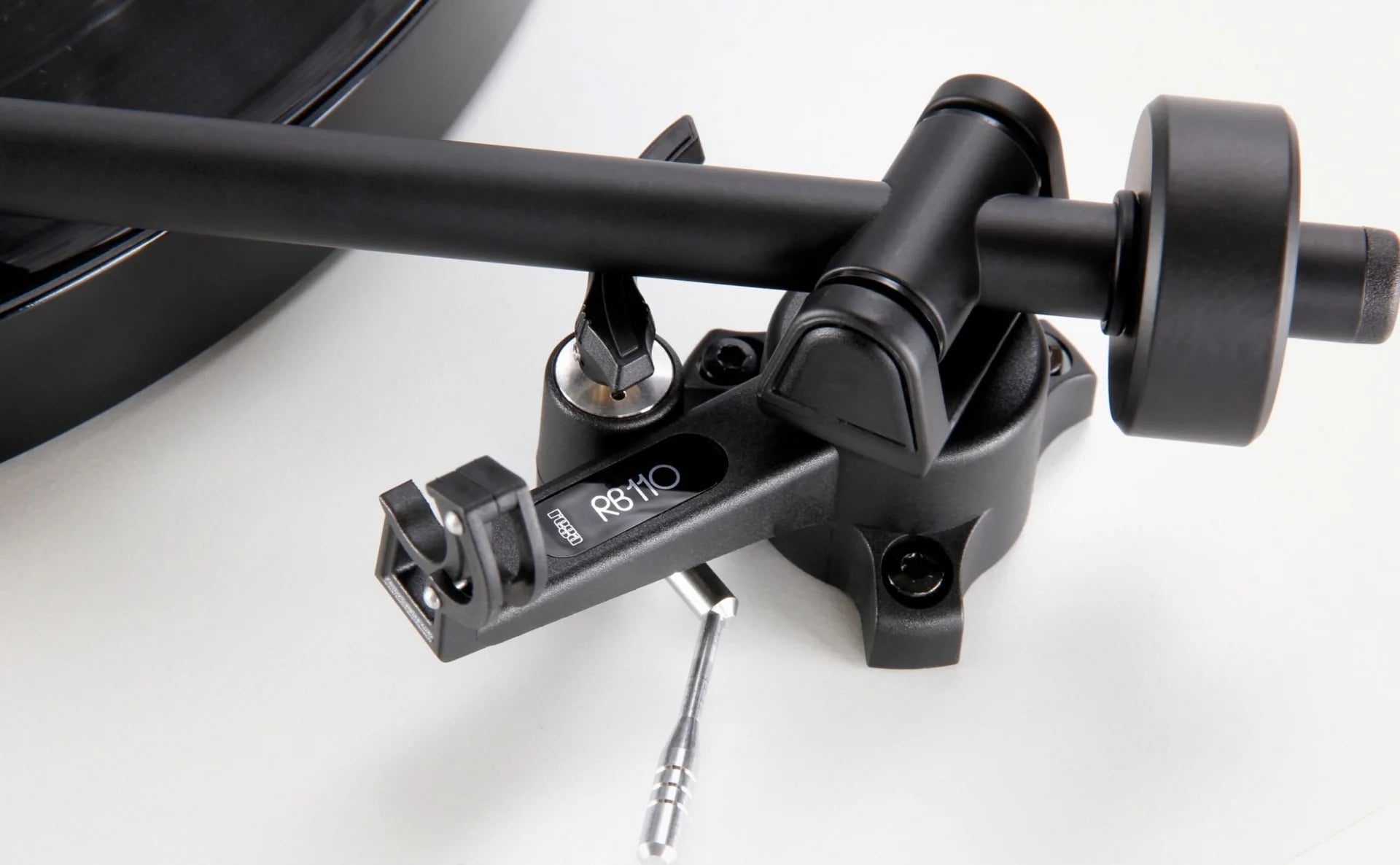 Rega Planar 1 turntable with matte finish, featuring a sleek design and tonearm for high-quality vinyl playback.