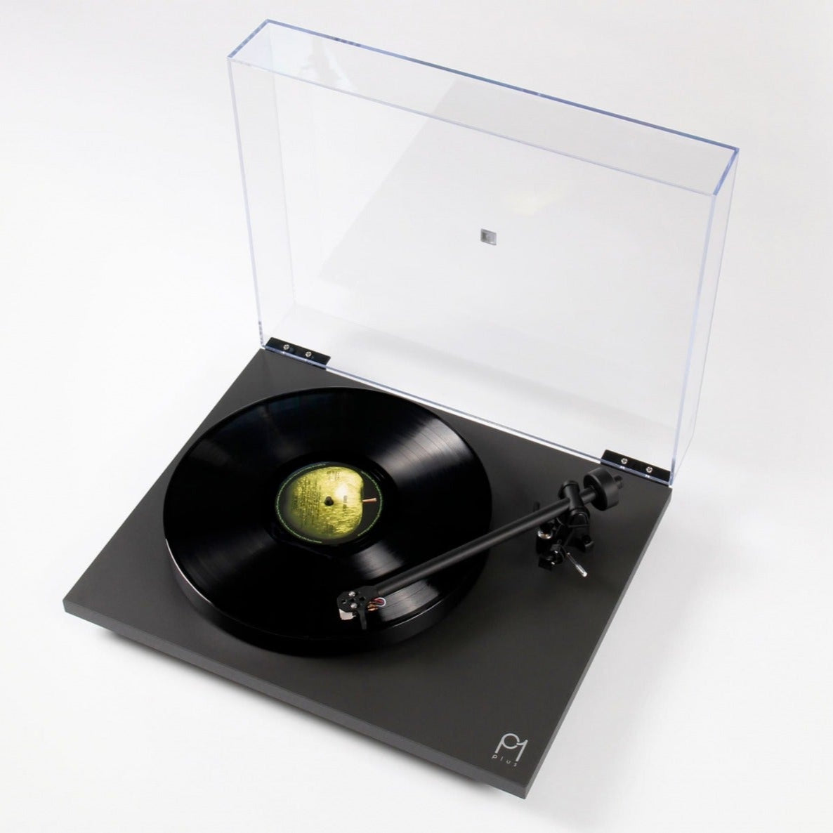 Rega Planar 1 Plus turntable with matte finish, featuring a sleek design and tonearm, displayed on a clean background.