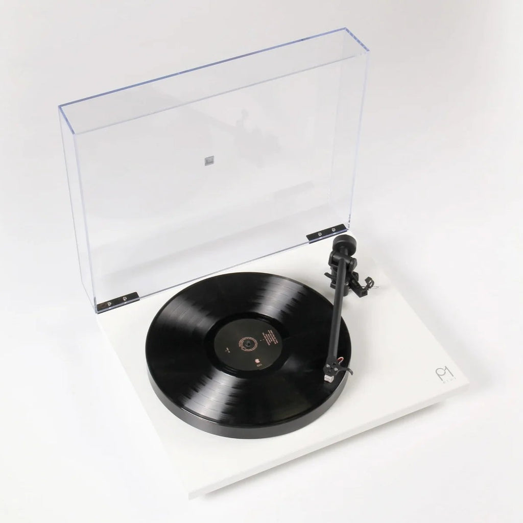 Rega Planar 1 Plus turntable with matte finish, featuring tonearm and platter, showcasing modern turntable design.