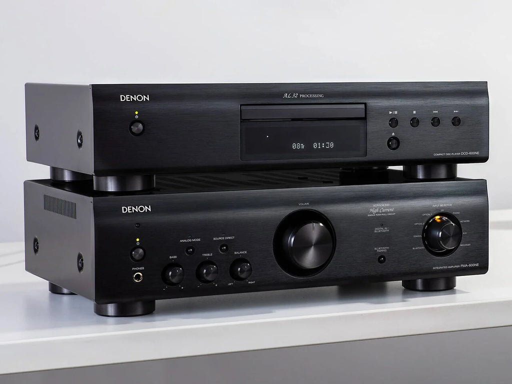 Denon PMA-600NE stereo amplifier with black metal casing and control knobs on the front panel.