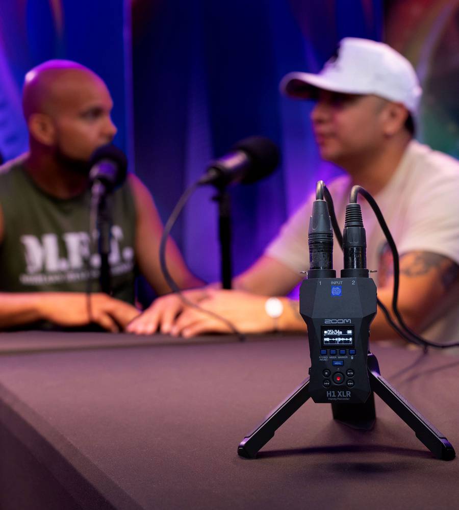 Zoom H1 XLR digital recorder with microphone and controls, ideal for portable podcast recording and audio capture.