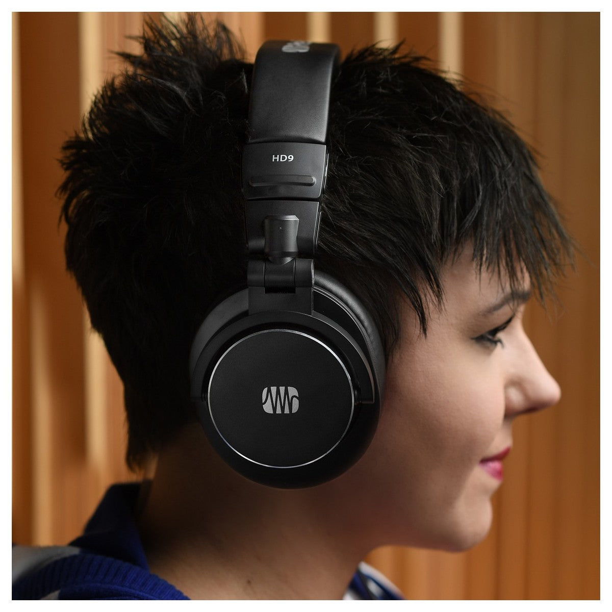 Presonus HD9 studio headphones with over-ear design and black ear cups, detailed view of the high-quality audio gear.