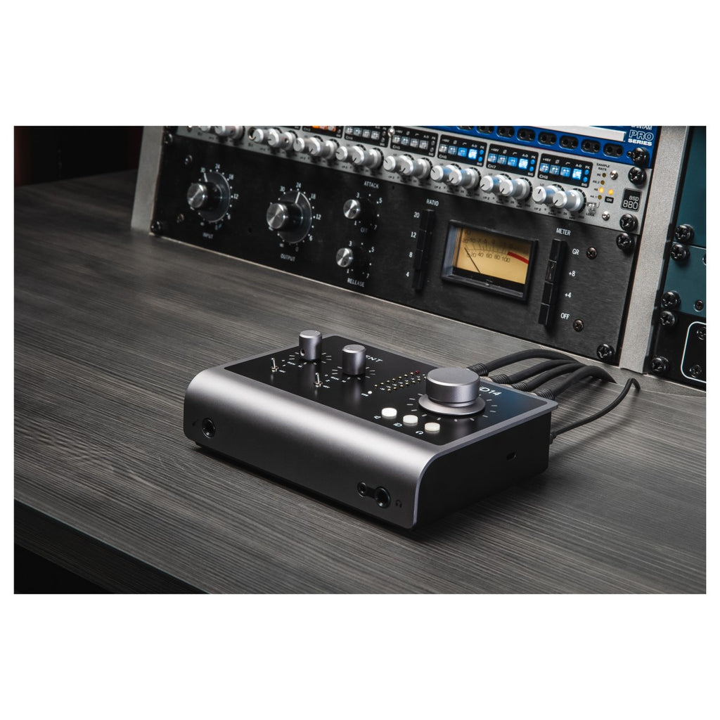 Audient iD14 MK2 audio interface with various input and output ports, compact design, and professional audio equipment.