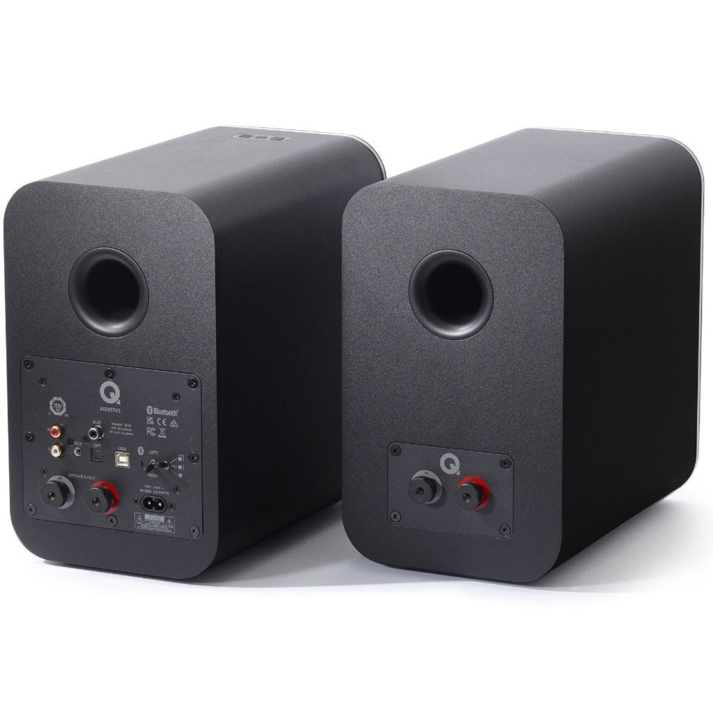 Q Acoustics M20 HD wireless speakers set with two sleek black speakers and control panel for high-quality audio.