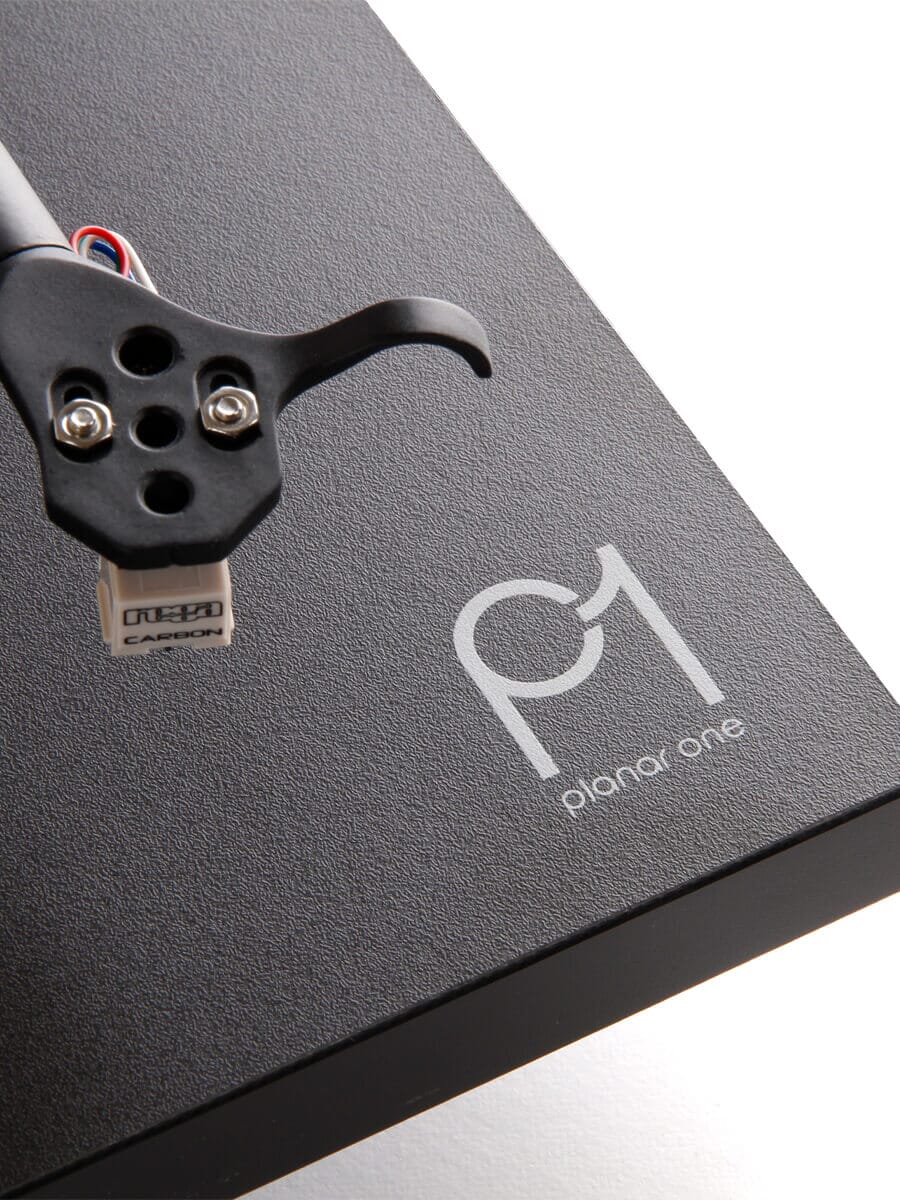 Rega Planar 1 black matte turntable showing tonearm and platter with detailed close-up view
