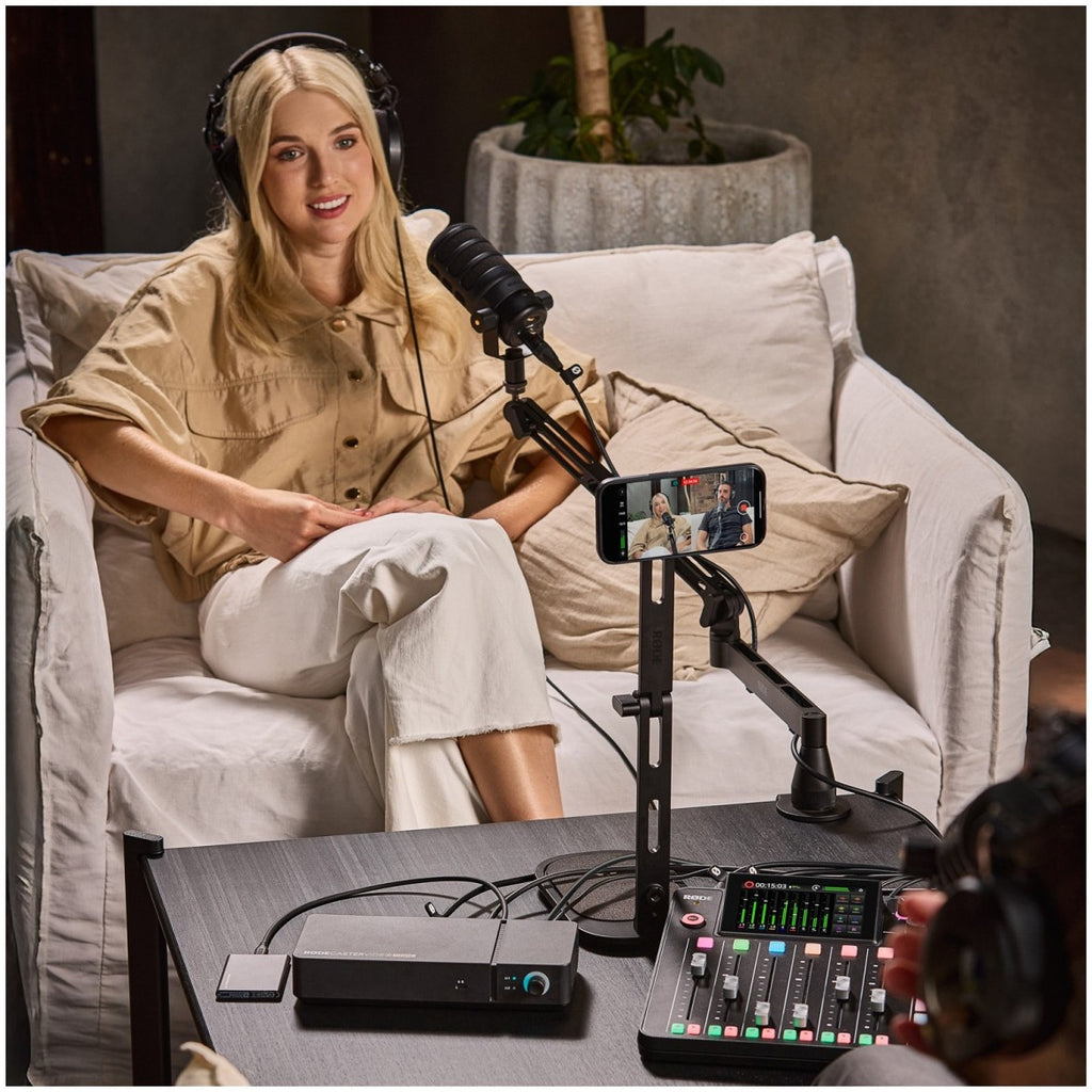 Rode DS3 black desktop studio arm holding a phone during a podcast recording