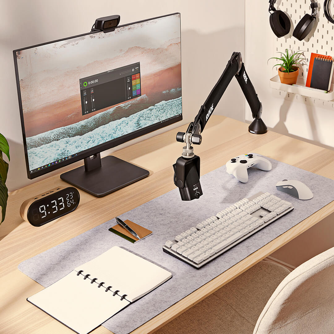 Rode NT-USB Mini USB microphone on a desk, featuring its compact design and built-in stand for high-quality audio recording.