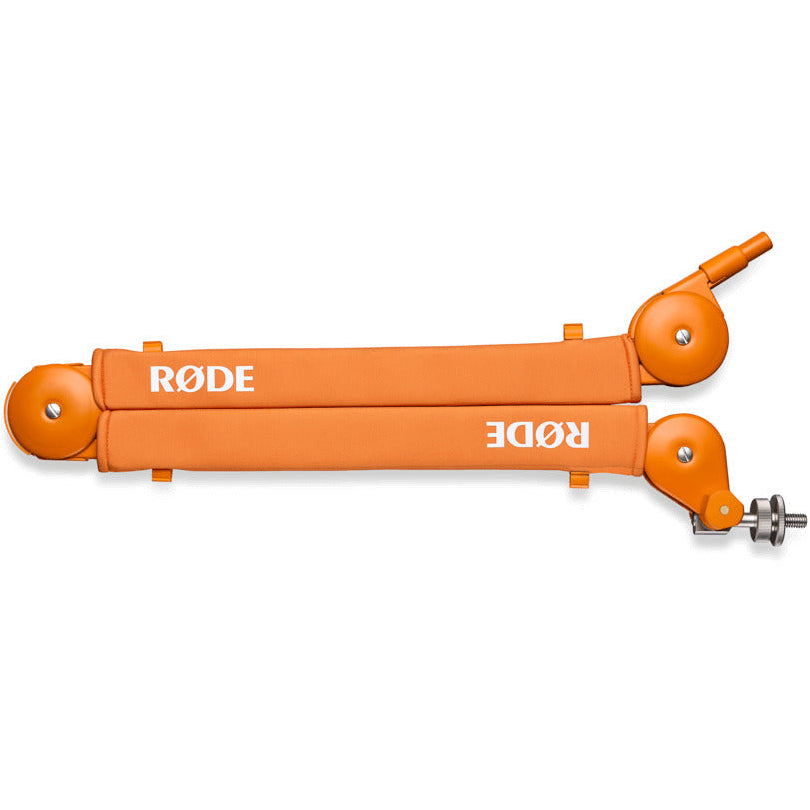 Rode PSA1+ broadcast microphone arm in vibrant orange, adjustable metal arm for studio and broadcasting setups.