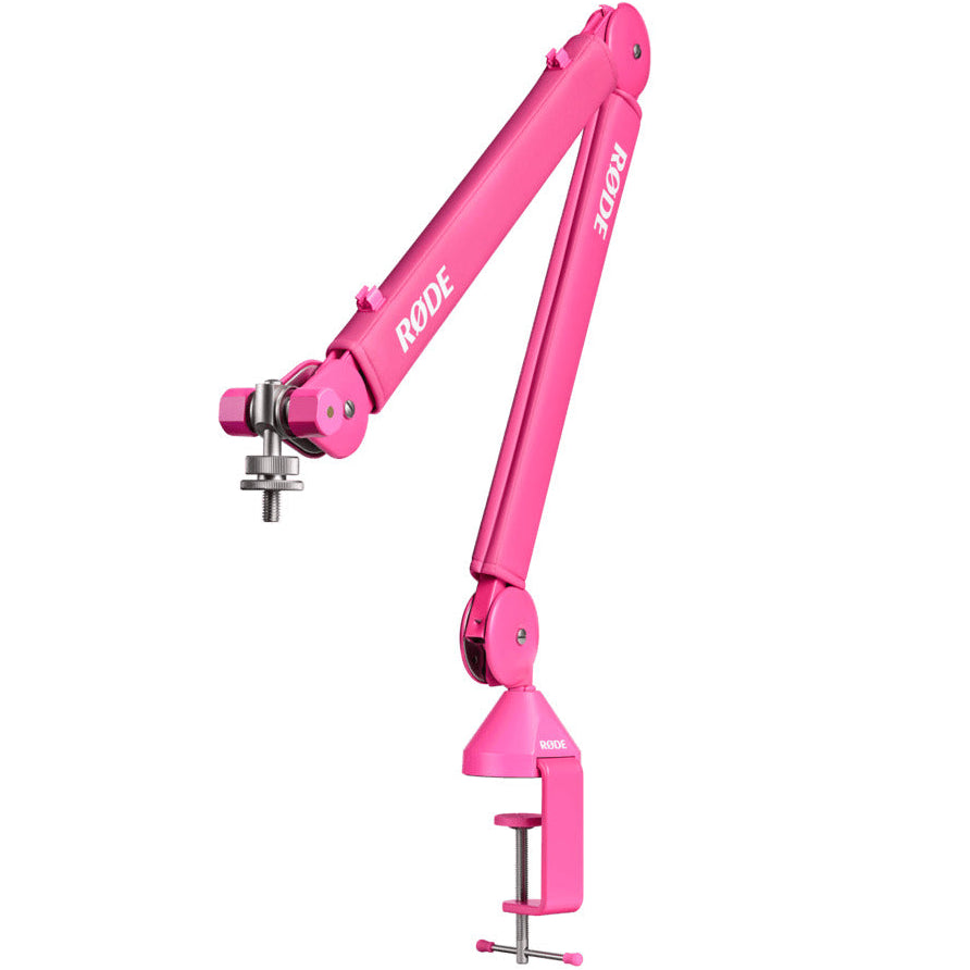 Rode PSA1+ broadcast microphone arm in pink, showing three-quarter view with adjustable arm and mounting clamp.