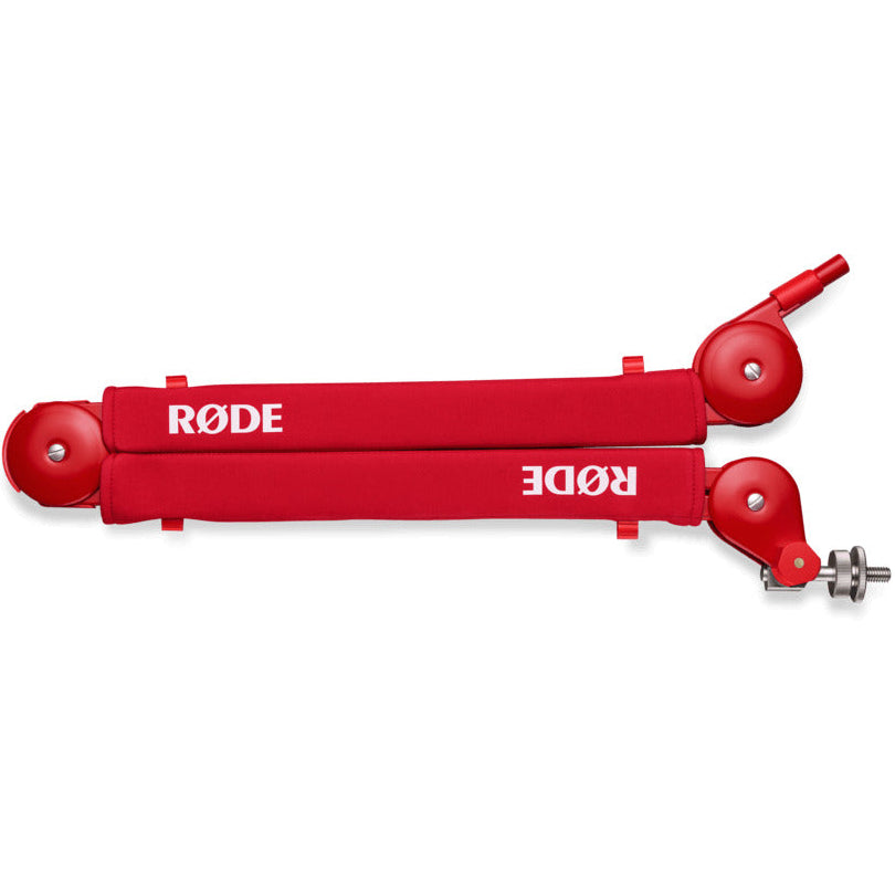 Rode PSA1+ broadcast microphone arm in red, mounted and adjustable for professional audio recording setups.