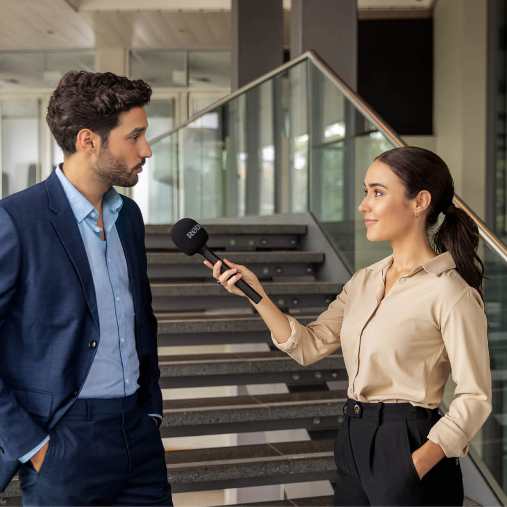 Rode Interview GO handheld microphone adapter for Wireless GO, shown with creator wireless microphone system setup.