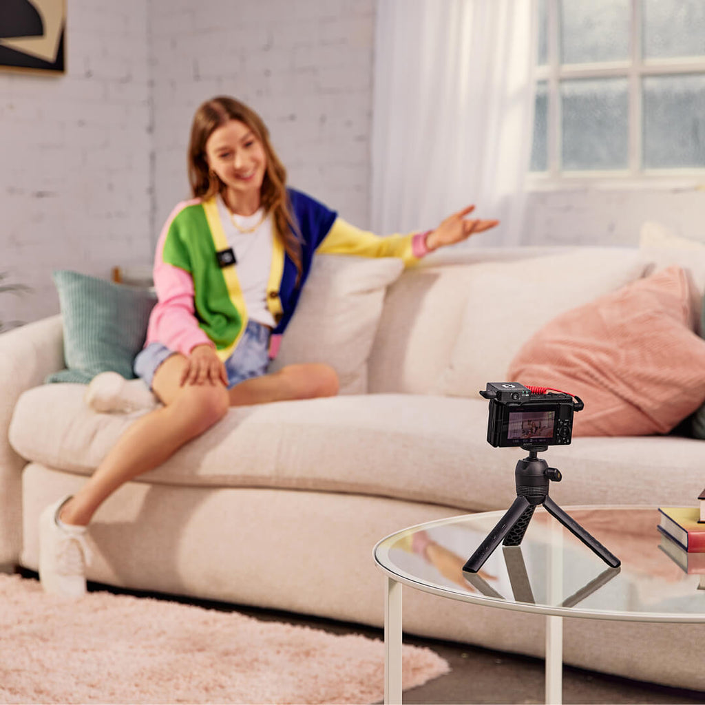 Rode Wireless ME creator wireless microphone system set up in a pastel living room environment with on-camera use.