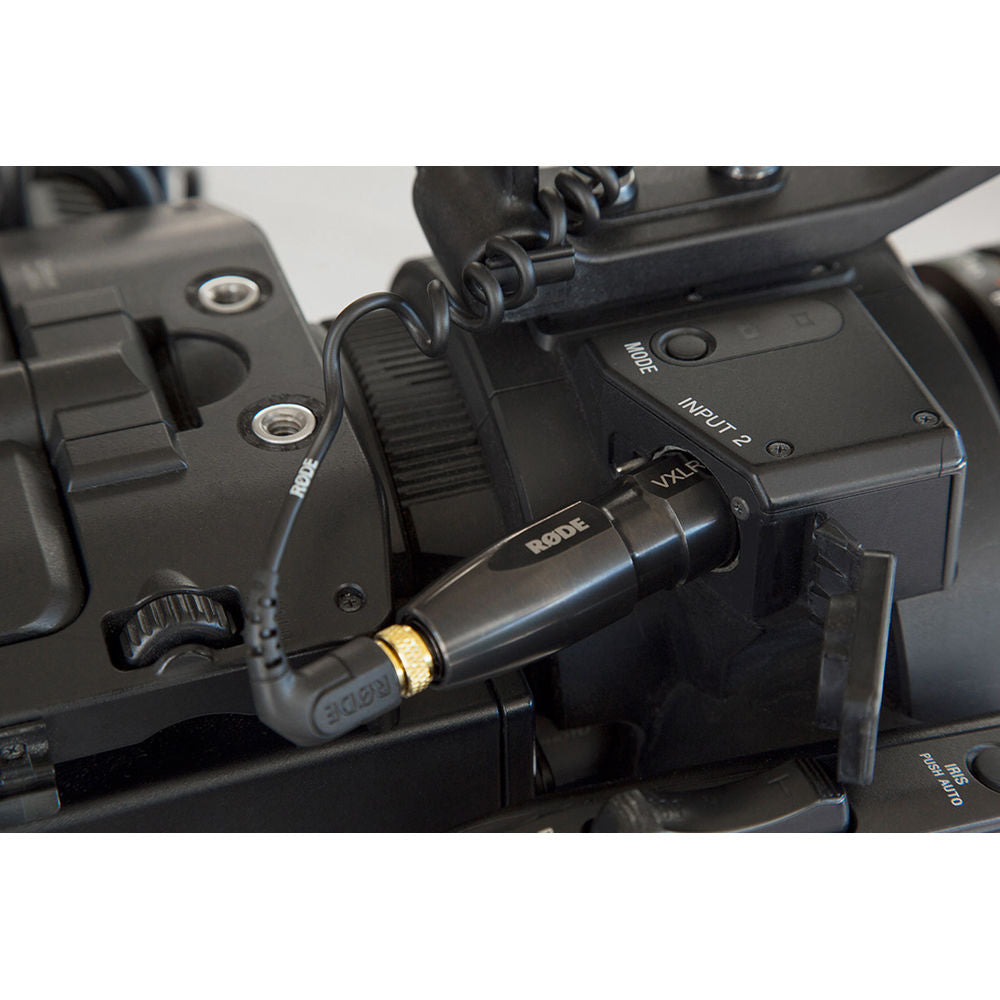 Rode VXLR+ adapter splitter for audio connections, compact black device with input and output jacks, used for professional audio setups.
