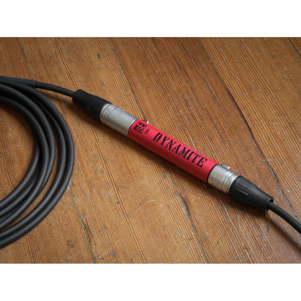 SE Electronics DM1 Dynamite microphone preamp in black, with control knobs and input/output connections visible on a professional audio device.