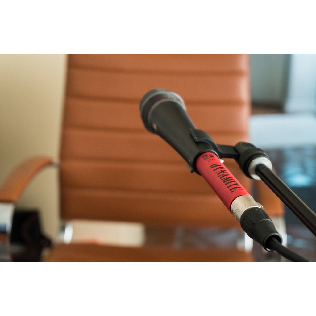 SE Electronics DM1 Dynamite microphone preamp in black, compact design with control knobs and input/output jacks for audio enhancement.