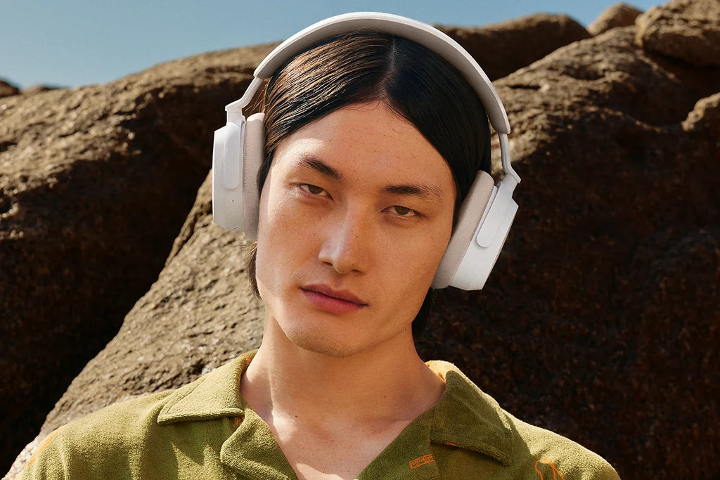 Sennheiser Accentum Wireless headphones worn by a man outdoors, showcasing sleek white design and comfortable fit.