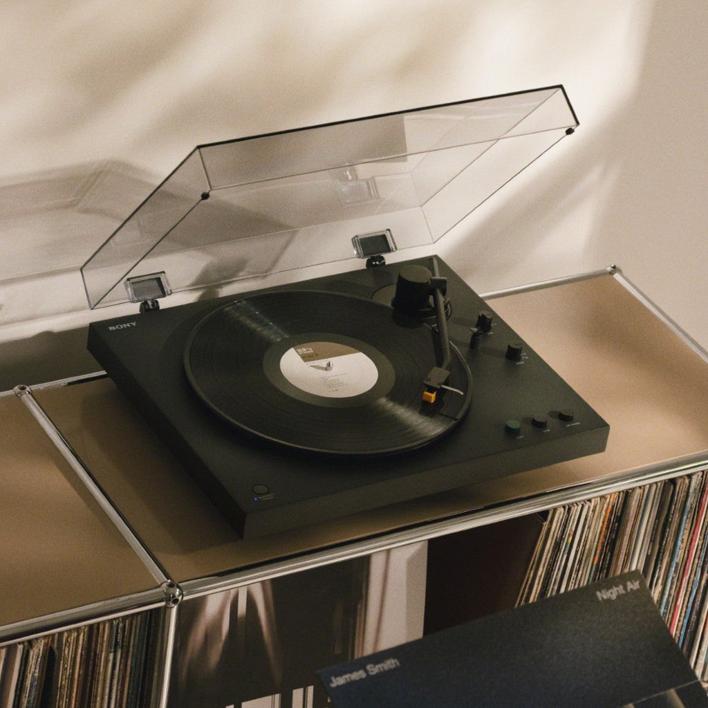 Sony PS-LX5BT turntable with vertical vinyl storage, featuring a sleek design and Bluetooth connectivity.