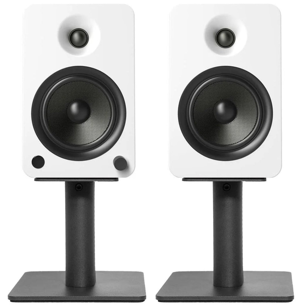 Kanto Audio SP6HD 6-inch desktop speaker stands supporting audio equipment on a clean surface, designed for optimal sound placement.