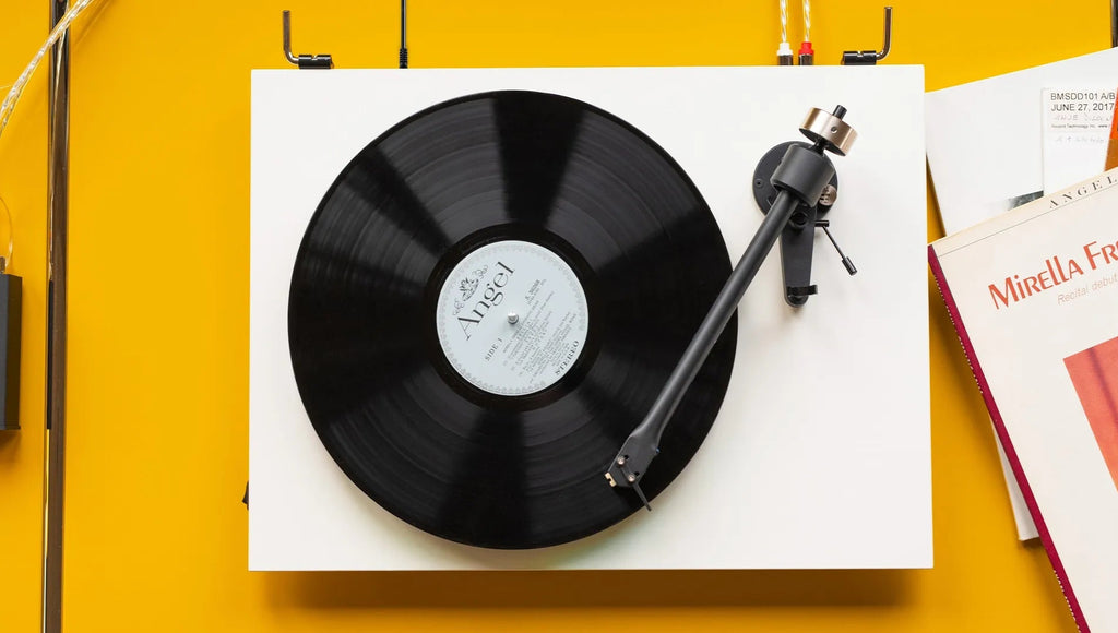Pro-Ject T2 Super Phono turntable with sleek design, featuring a black finish and modern audio components.