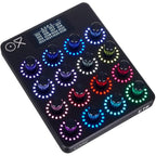 OXI Instruments E16 MIDI controller with knobs and pads, designed for music production and live performance.