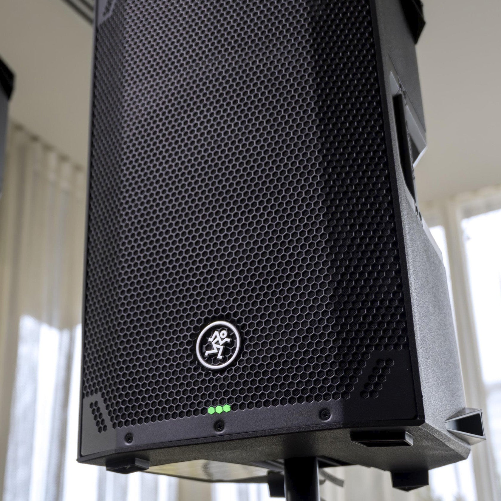 Mackie Thump12v4 active loudspeaker with black enclosure, front grille, and control panel, ideal for sound reinforcement.