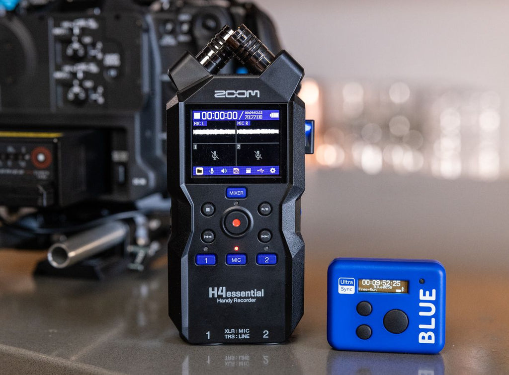 Zoom H4n Essential digital recorder with built-in microphones and controls, shown with timecode display and recording interface.