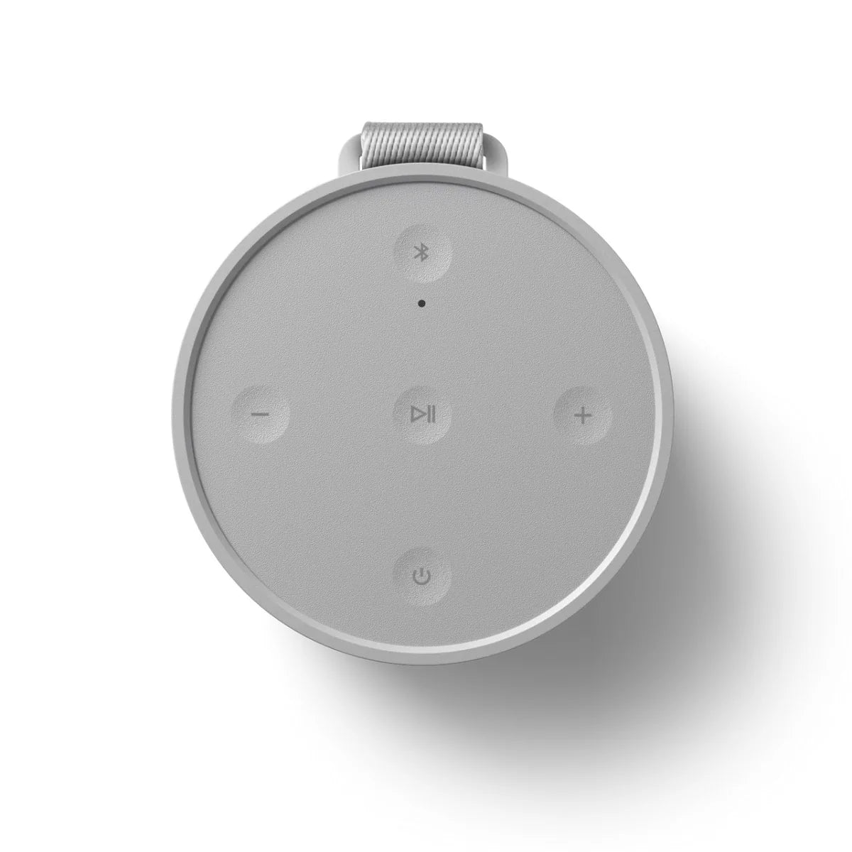Bang & Olufsen Beosound Explore portable speaker with rugged design and top controls, shown from the top angle.