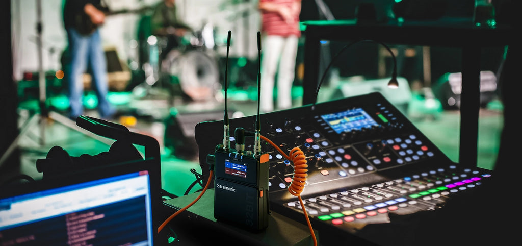 Saramonic K9 professional wireless microphone system with handheld microphone and receiver, ideal for audio recording and broadcasting.