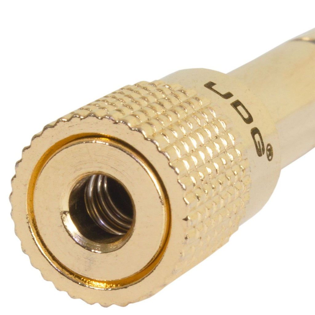 UDG Ultimate headphone jack adapter plug connected to audio device, compact UDG headphone adapter for improved sound connectivity.