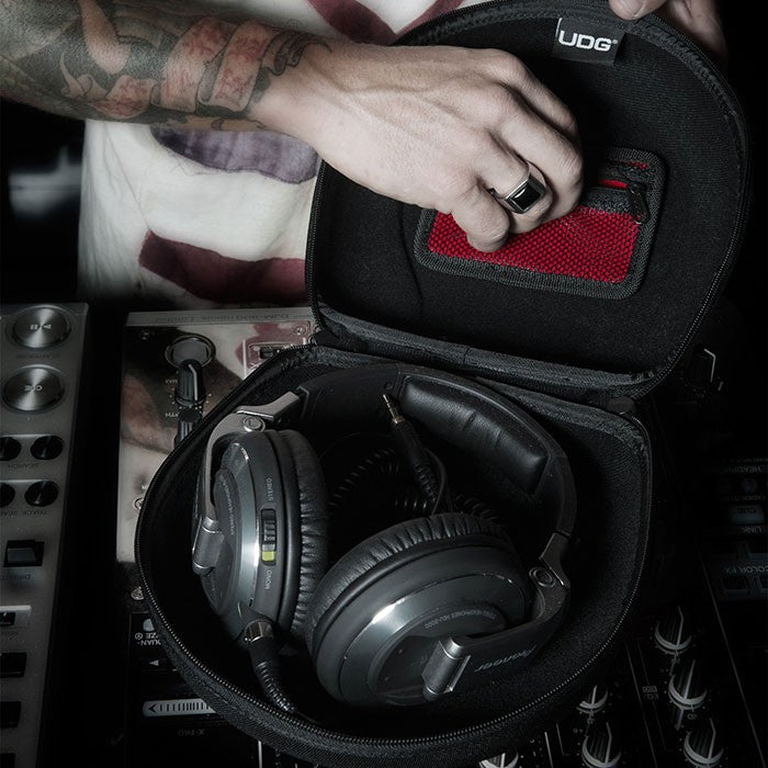 Large UDG Creator headphone hard case in black with padded interior for protection of headphones and accessories.