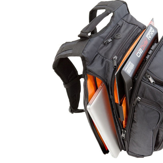 UDG Digi Backpack in black and orange, featuring multiple compartments for DJs and music equipment storage.