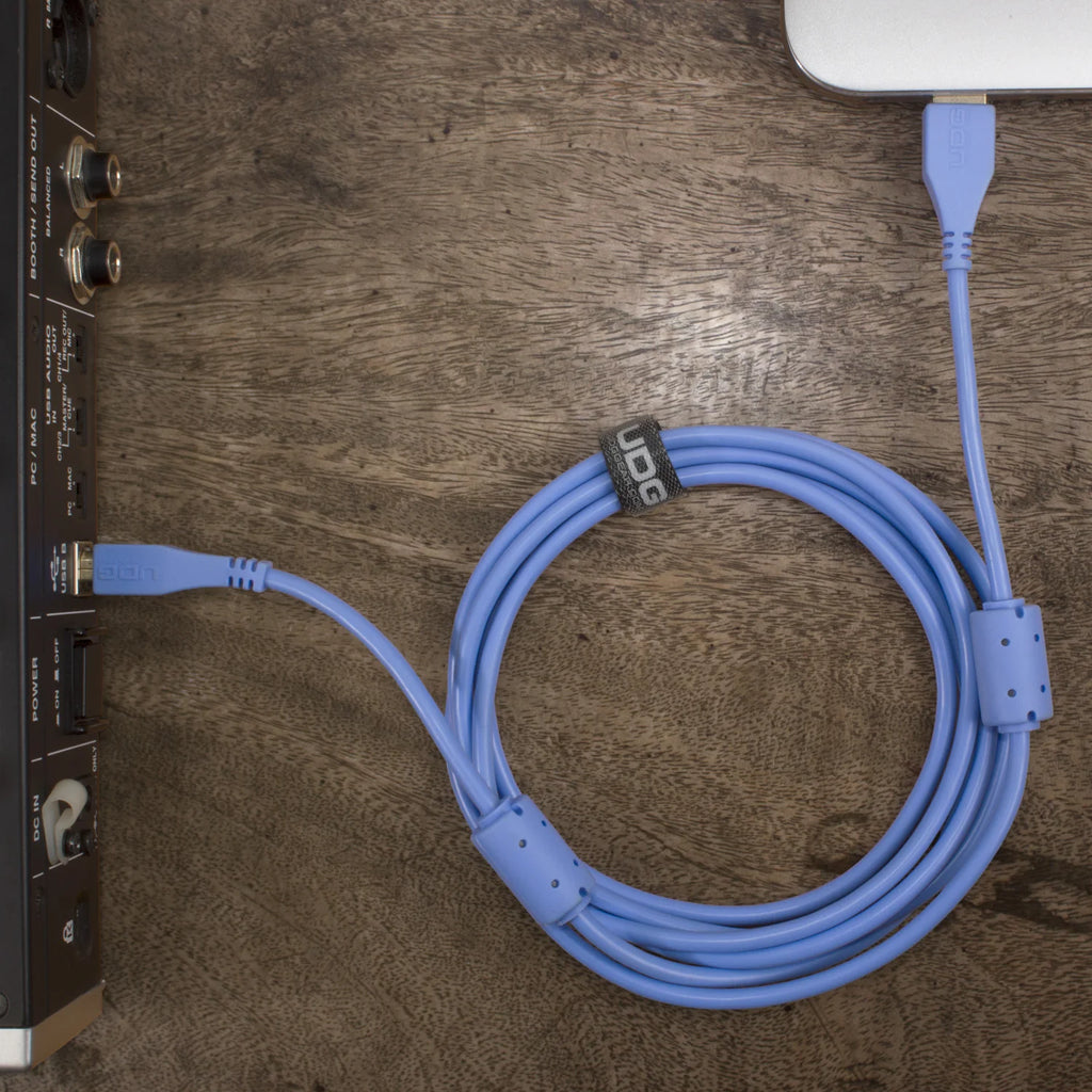 UDG Ultimate Audio Cable USB 2.0 A-B, straight, 2m, light blue, with USB-C connectors, used for audio and data transfer.