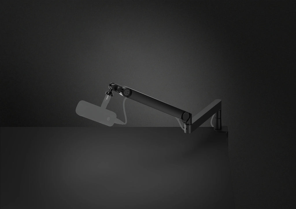 Elgato Wave Mic Arm Pro broadcast microphone arm attached to a desktop setup with adjustable arm and microphone mount.