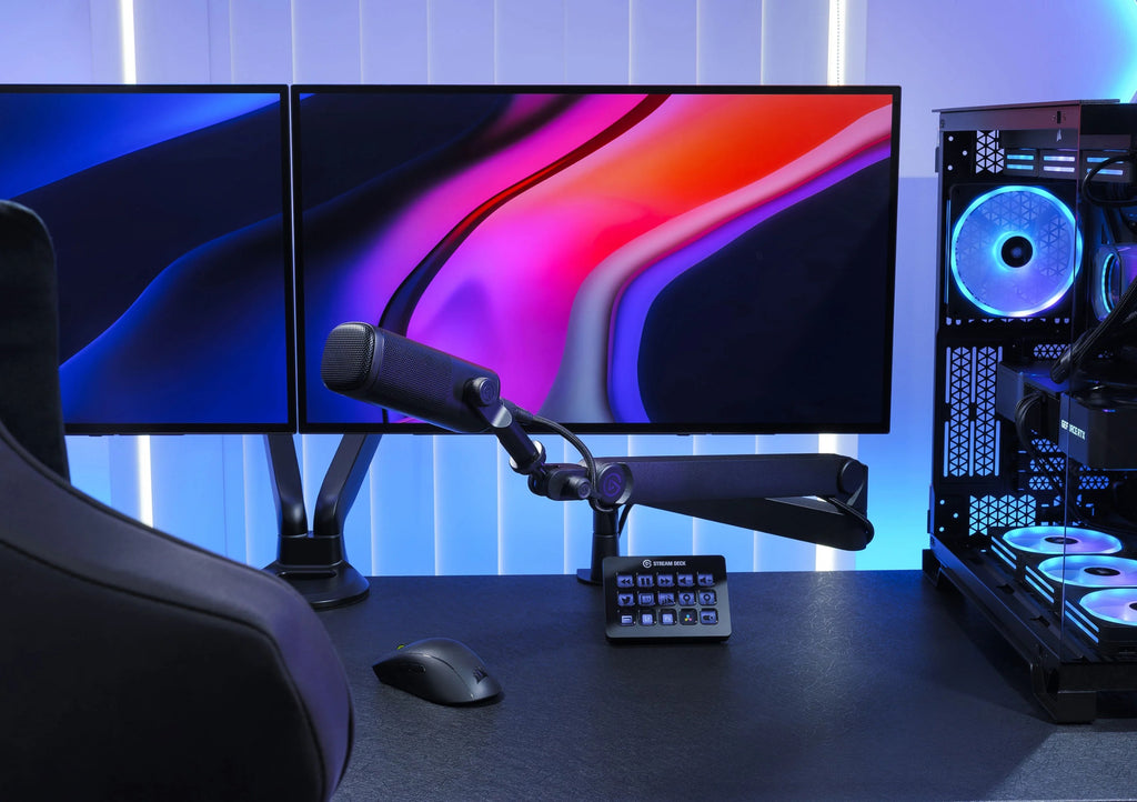 Elgato Wave Mic Arm Pro in black, adjustable broadcast microphone arm mounted on a desk with a microphone attached.