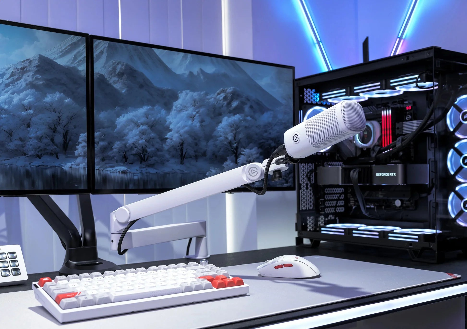 Elgato Wave Mic Arm Pro white broadcast microphone arm with adjustable joints, mounted on a desk for professional streaming setup.
