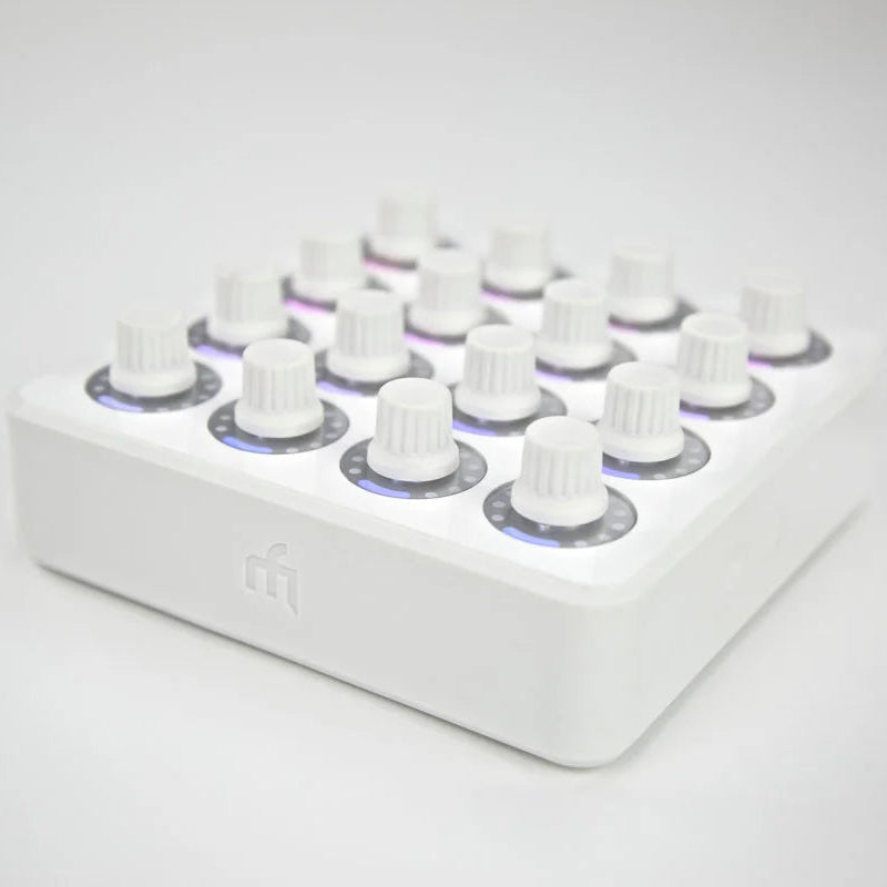 White DJ TechTools MIDI Fighter Twister MIDI controller with colorful knobs and buttons, used for music production and live DJing.