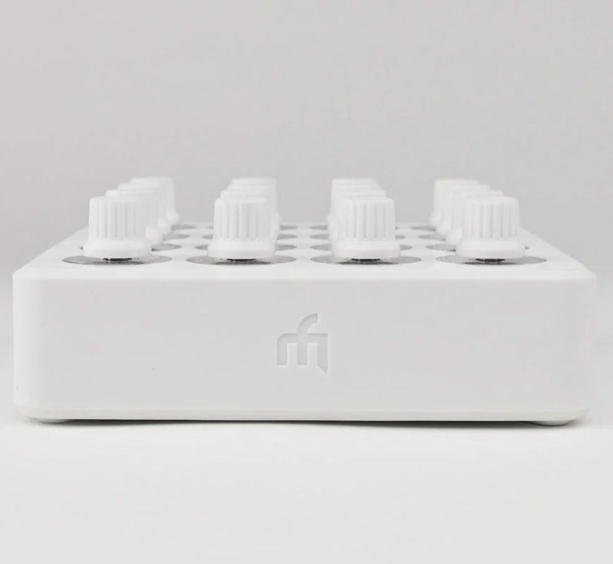 White DJ TechTools MIDI Fighter Twister MIDI controller with colorful rotary knobs and buttons, front view.