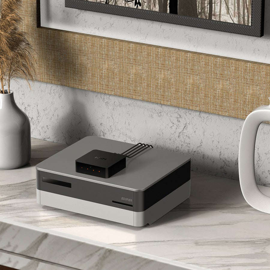 WiiM Pro Plus music streamer with sleek black design and control buttons, ideal for high-quality audio streaming.