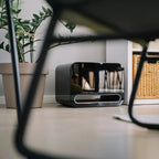 WiiM Sub Pro wireless smart subwoofer in black with 8-inch driver and 250W power, featuring Wi-Fi and Bluetooth connectivity.