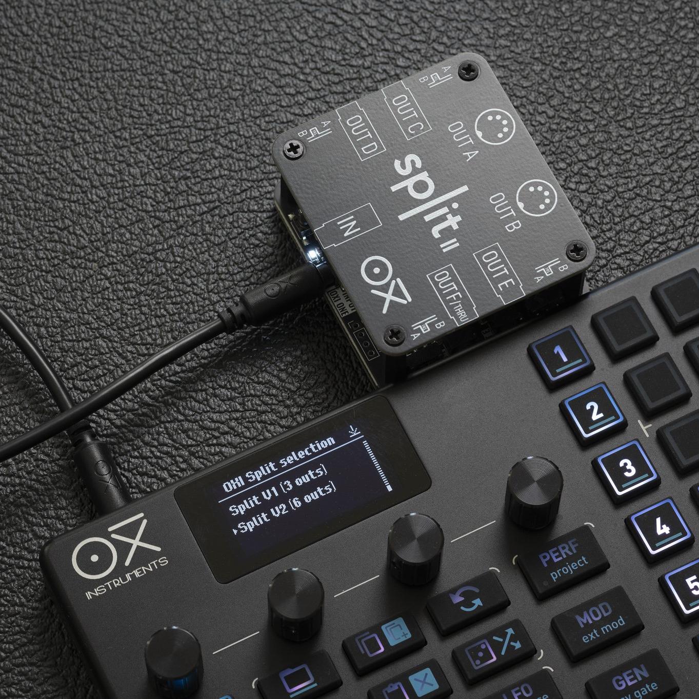 OXI Instruments Split 2 MIDI interface showing multiple ports and sleek design, ideal for music production and studio setup.
